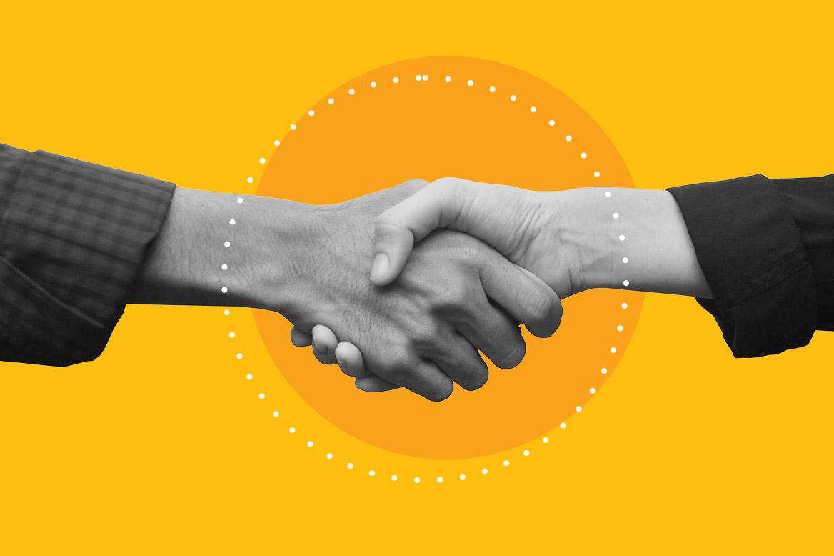 Two people shaking hands.