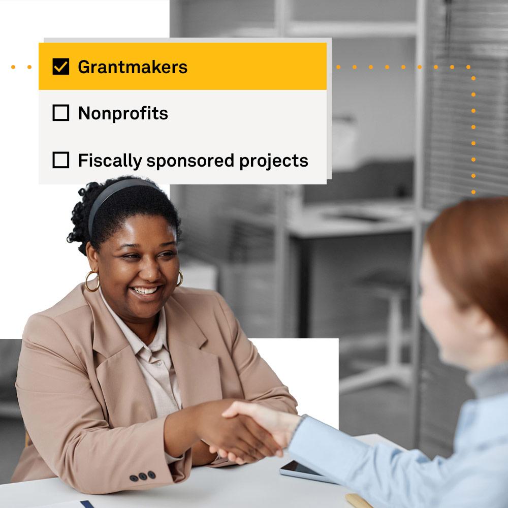 Woman shaking hands with new funder