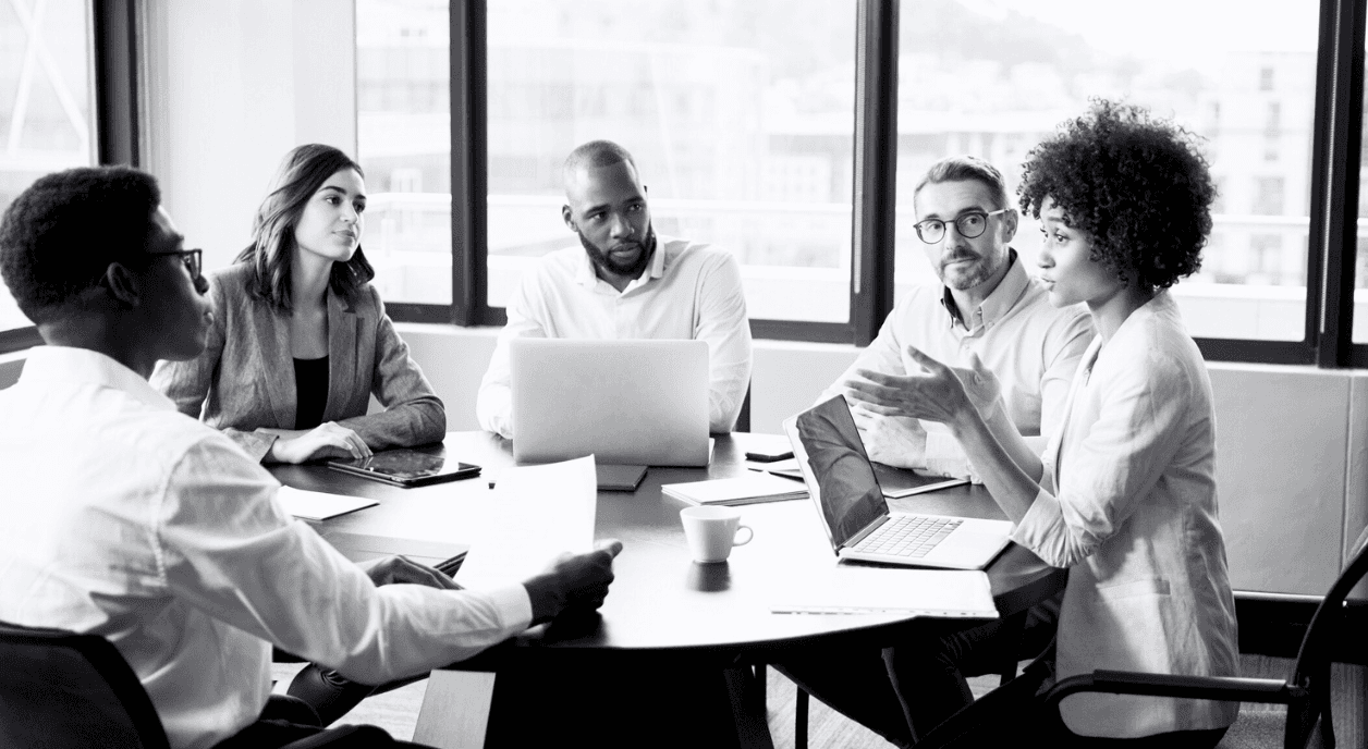 A group of communications professionals in a meeting.