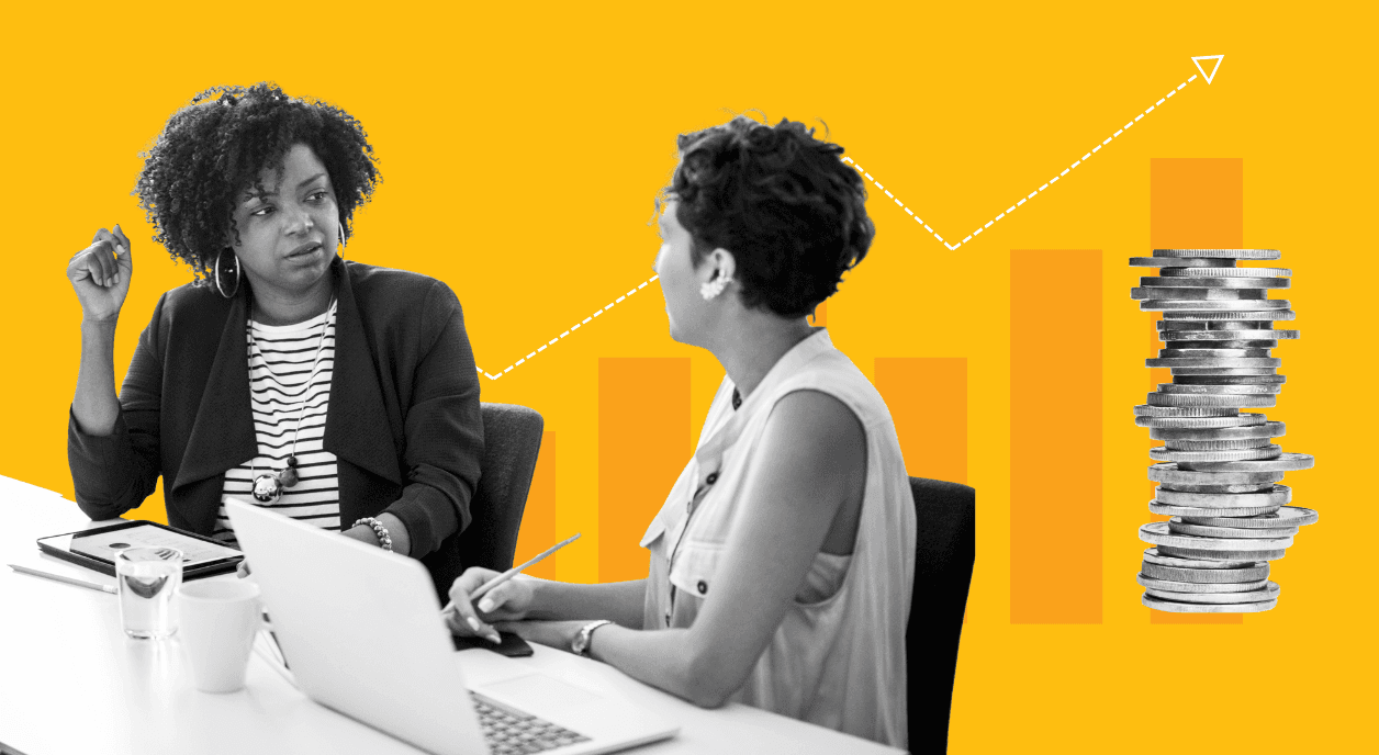 Two women look at nonprofit compensation data.