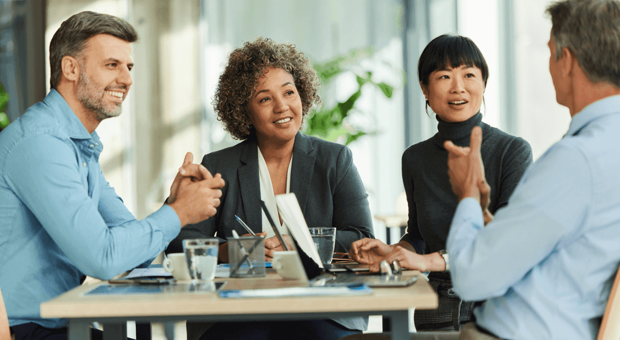 Colleagues discussing how to use AI authentically.