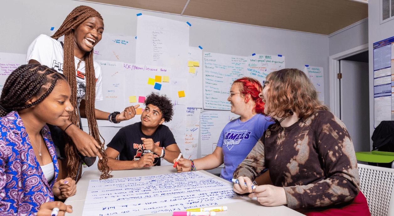 A group of colleagues coming up with nonprofit strategies.