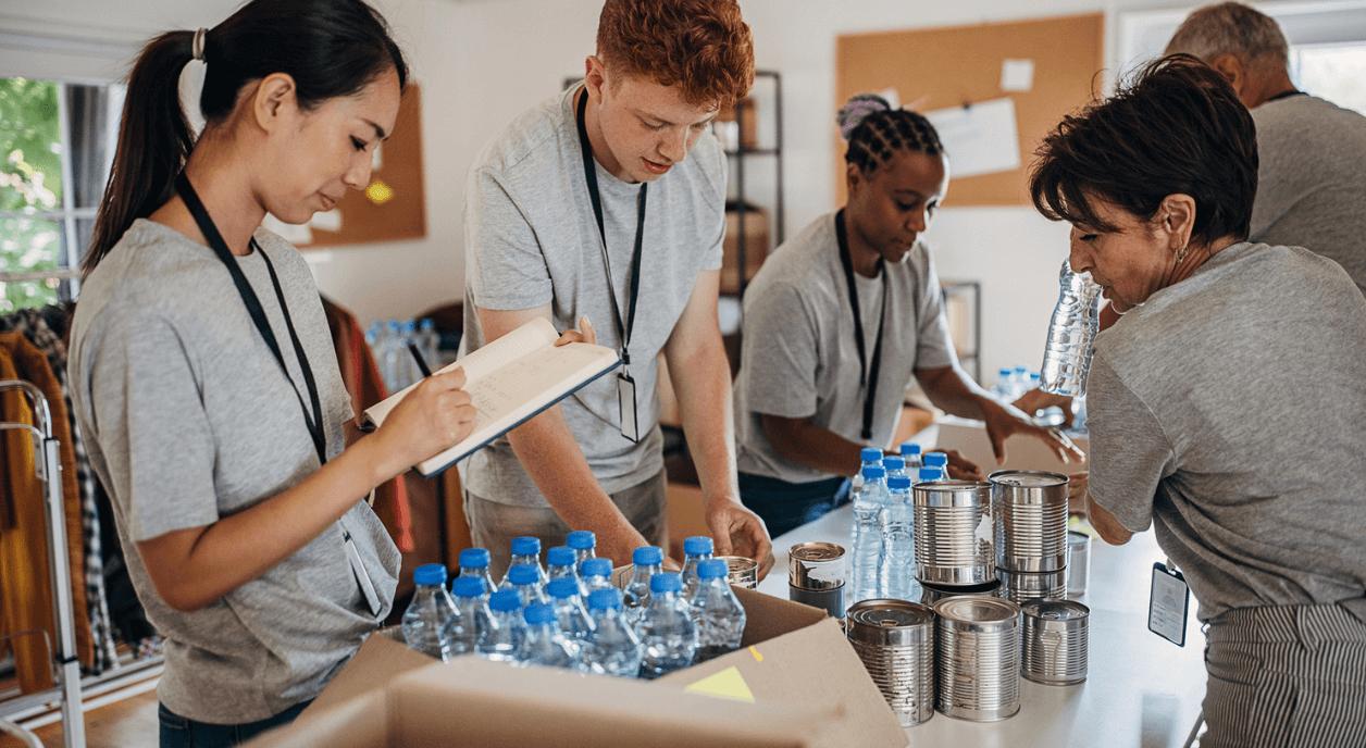 Nonprofit volunteers boxing up supplies.
