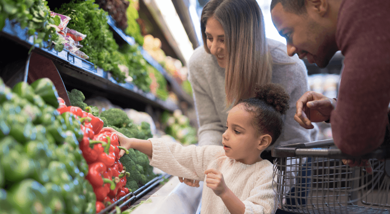 A family picking out groceries.
