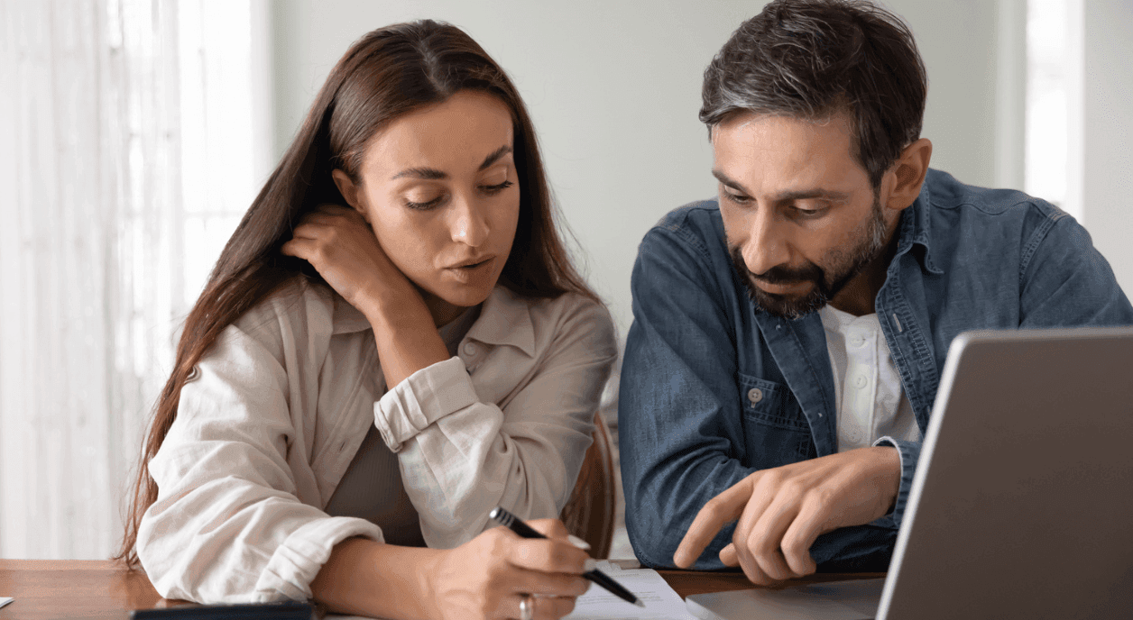 A couple figuring out their charitable tax deduction.