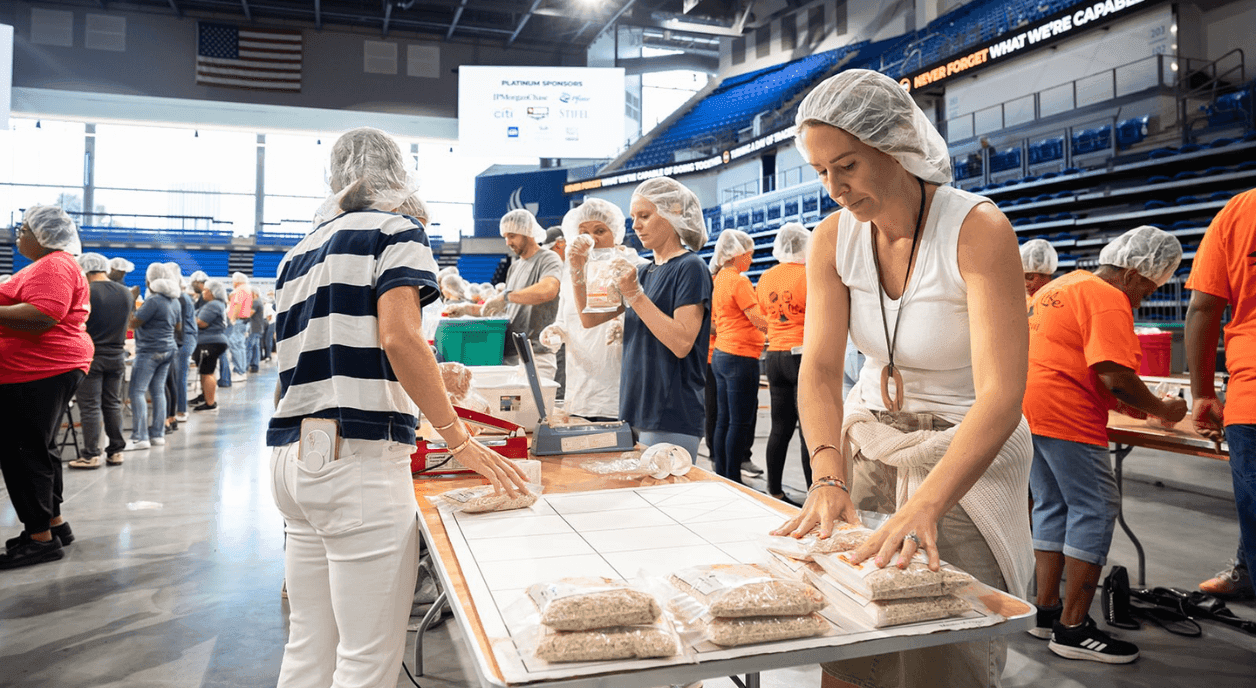 Volunteers in an assembly line.