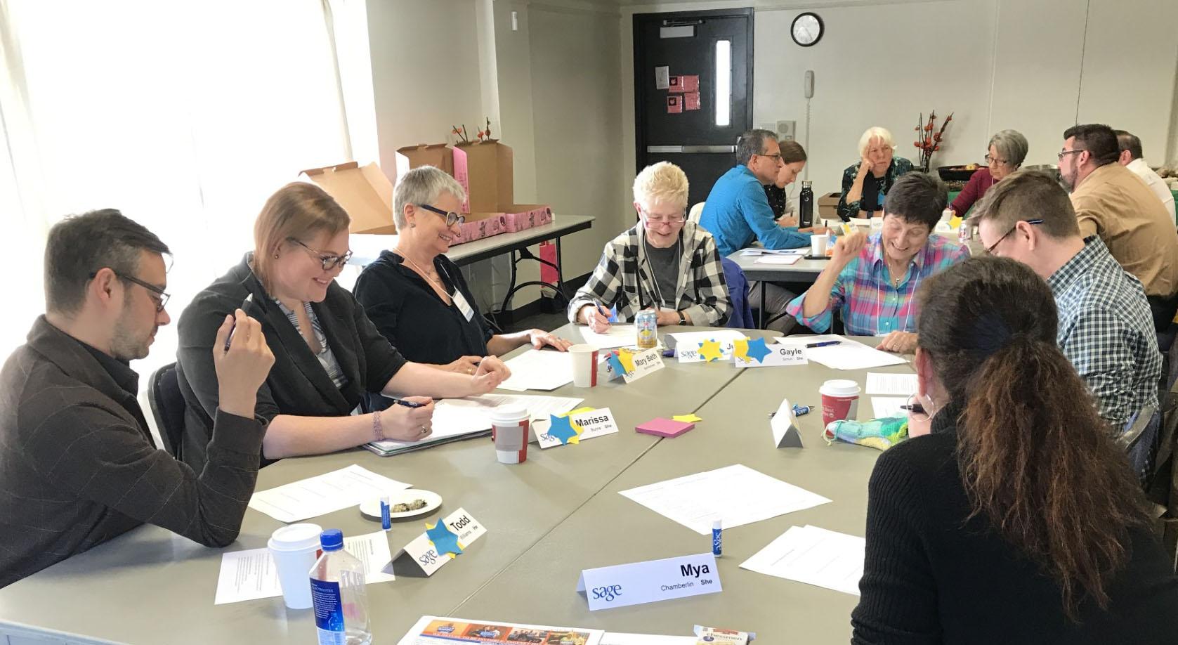 A group of elders providing feedback at the SAGE center.