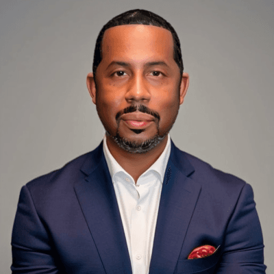 Headshot of Matthew L. Evans, Senior Director of Public Policy, United Philanthropy Forum, in a white shirt and royal bluejacket.