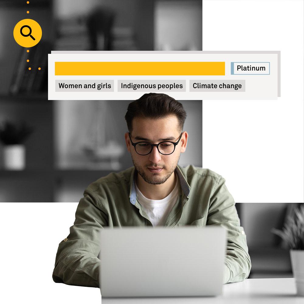 Man looking up nonprofits on computer.