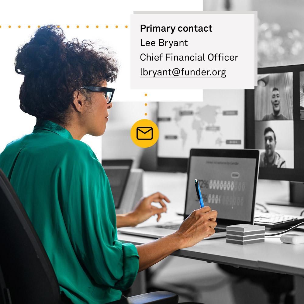 Woman looking up nonprofit contact information on computer