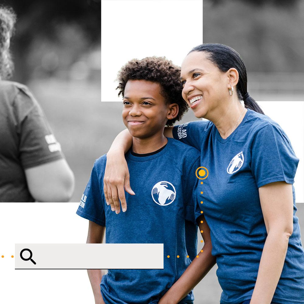 A mother and son volunteering together.