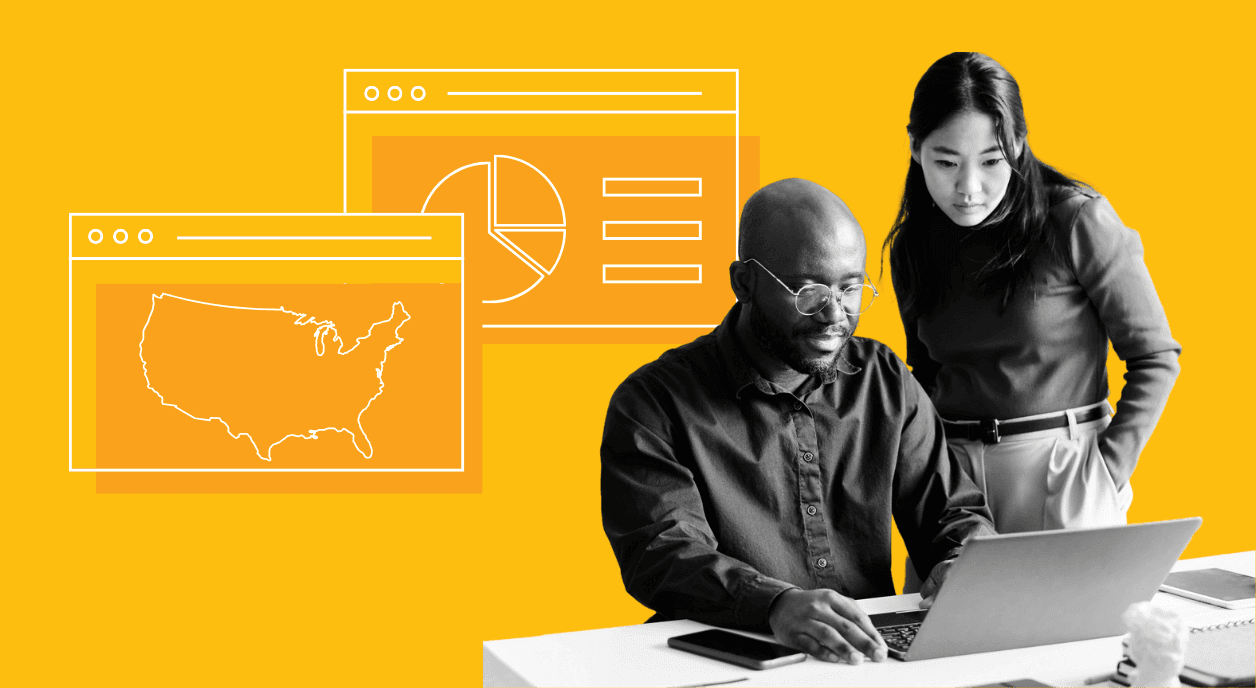 Two people looking at a dashboard of foundation funding by state.