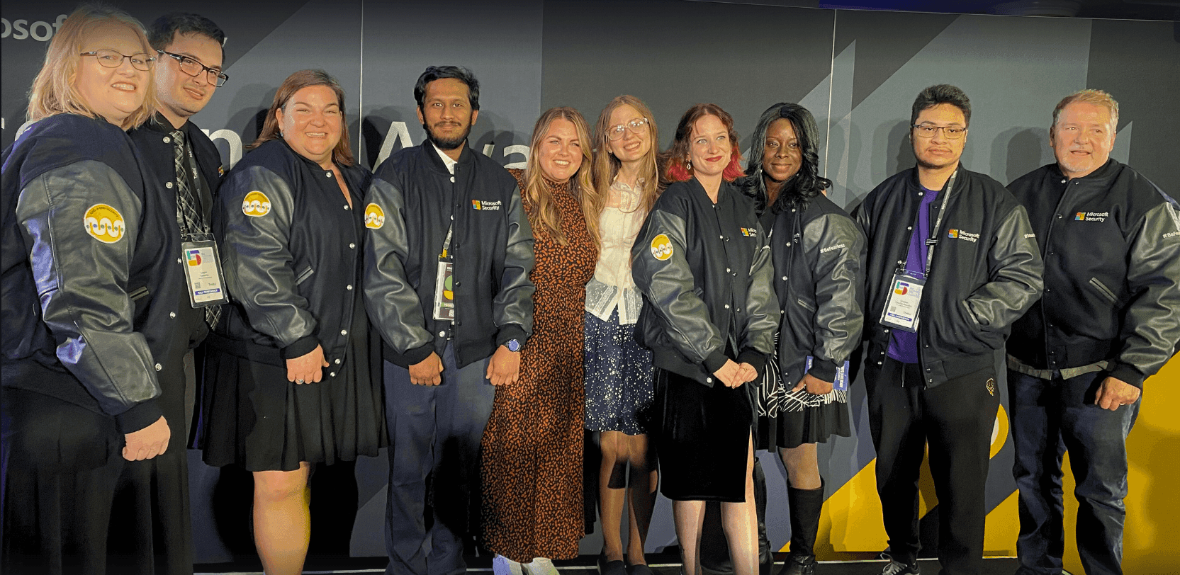 A group of students being awarded jackets.