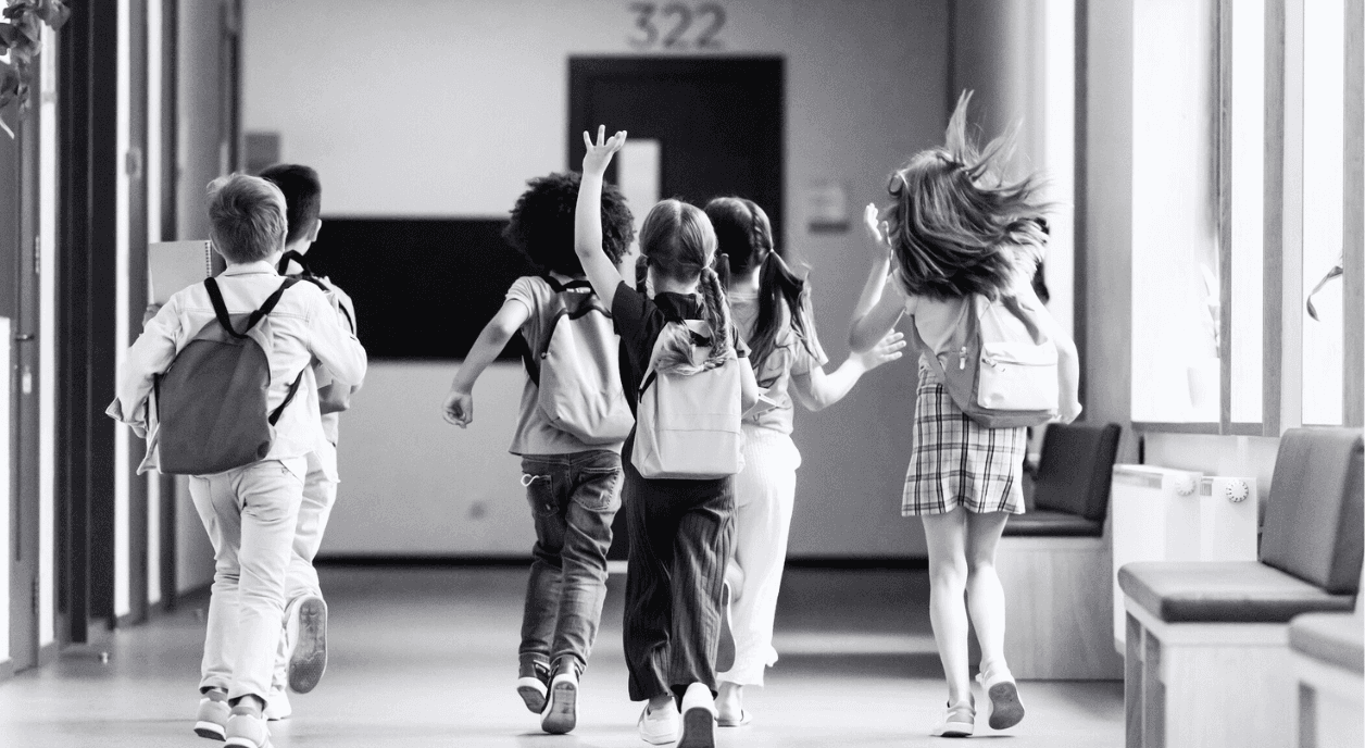 Little kids head into school.