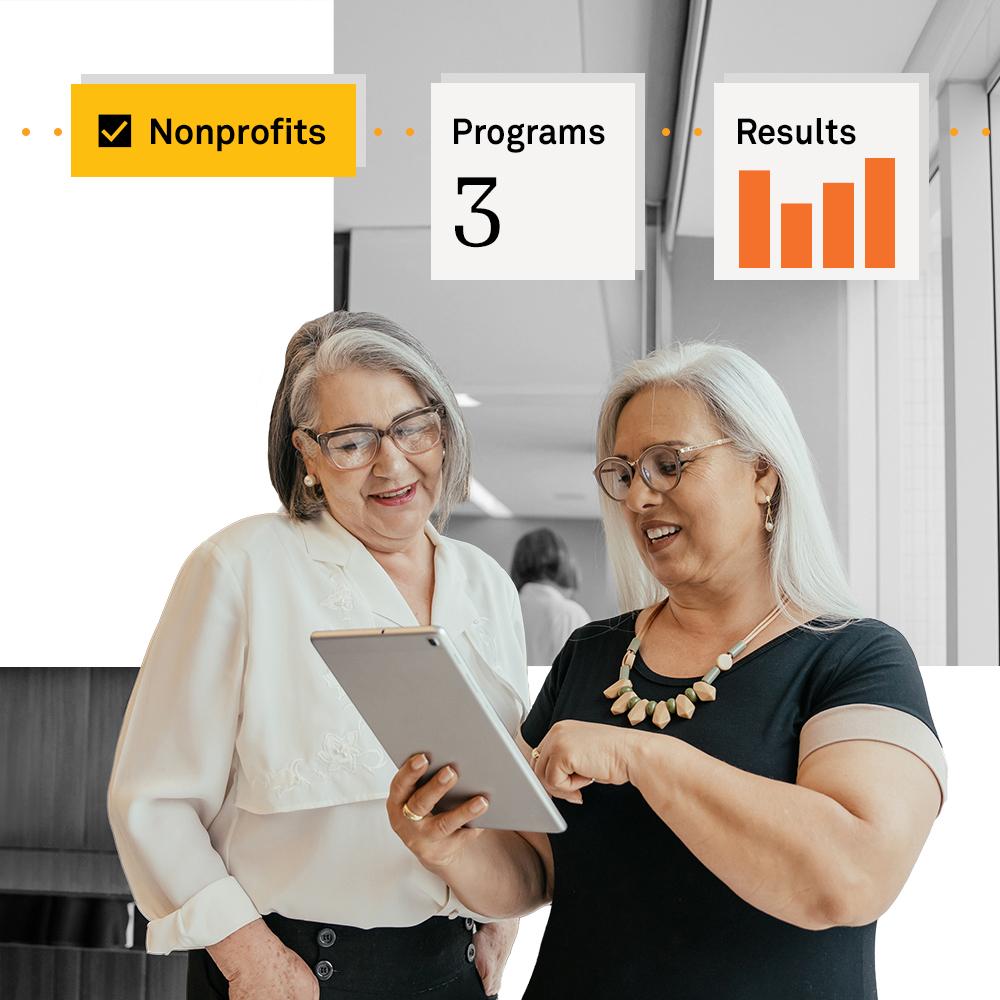 Two older funders searching for nonprofit information.