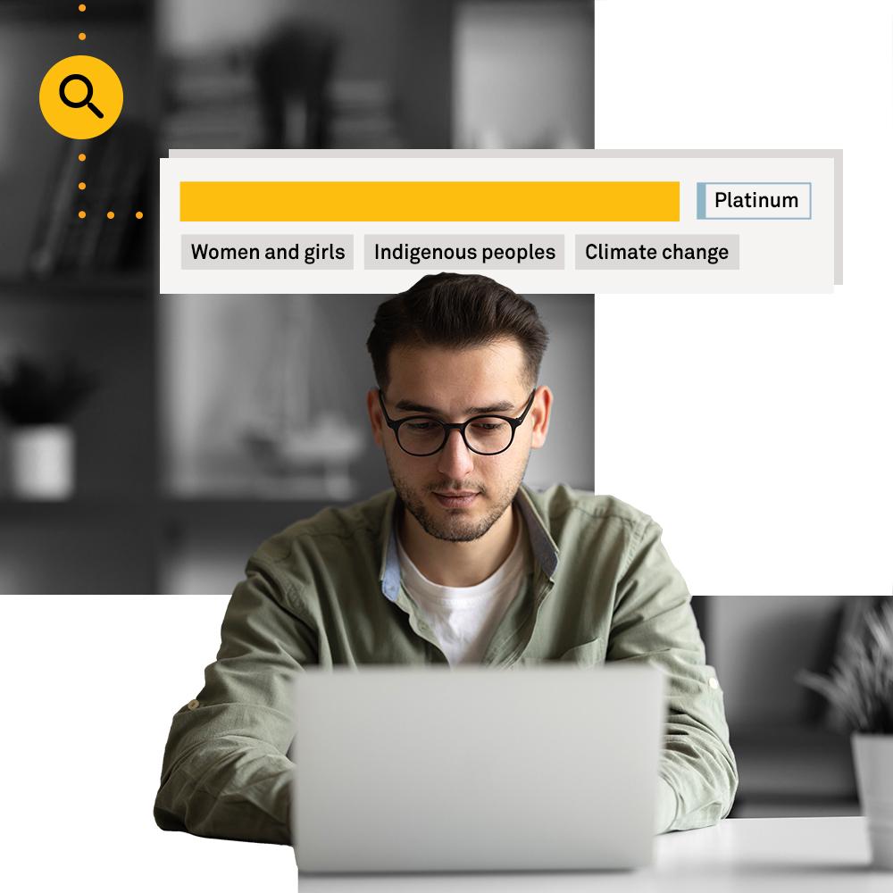 Man looking up nonprofits on computer.