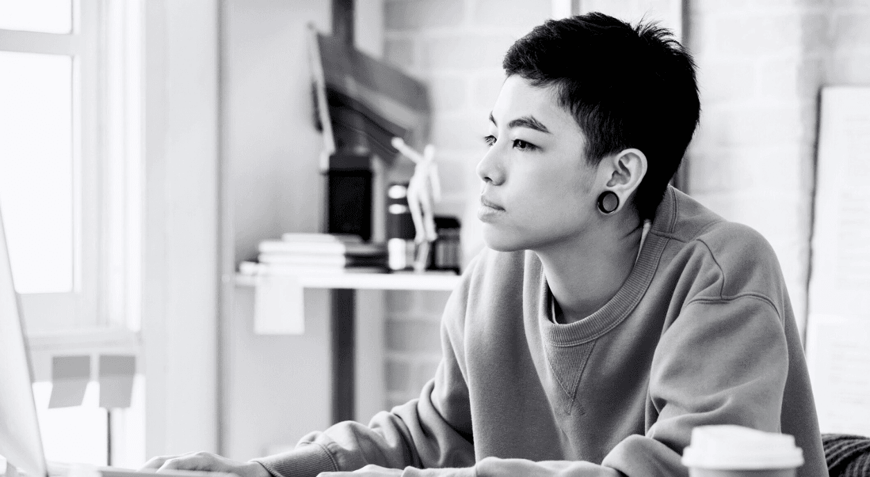 A woman looks at funding data for LGBTQIA+ communities.