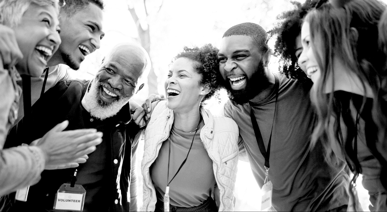 A group of volunteers enjoying serving their community.