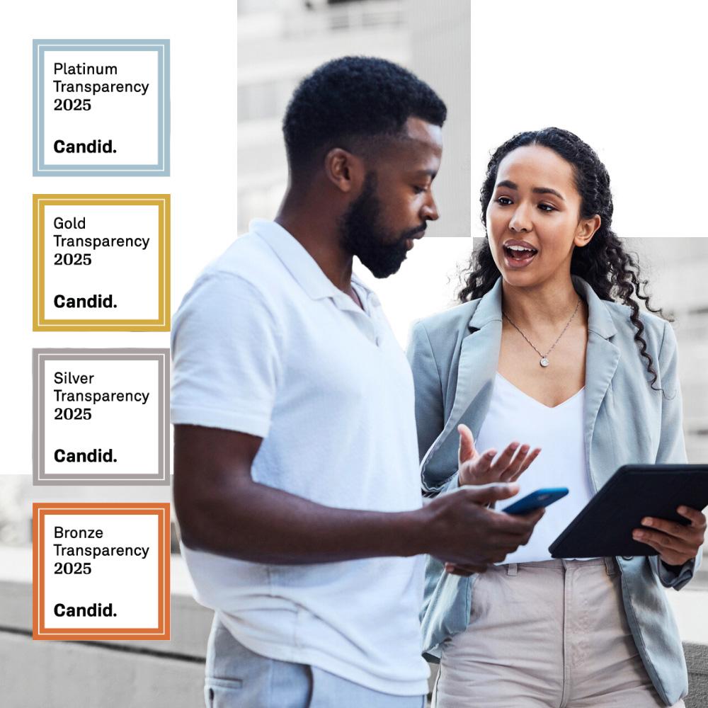 Two nonprofit colleagues looking at Seals of Transparency.