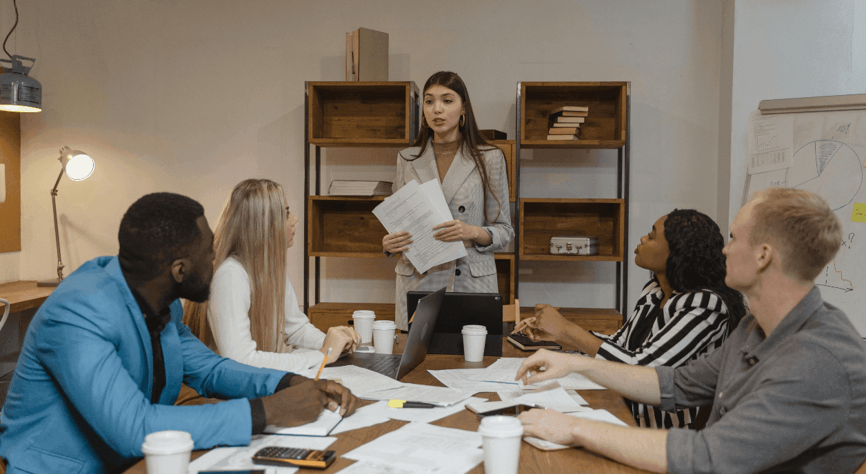 A woman talking to nonprofit colleagues about giving circles.