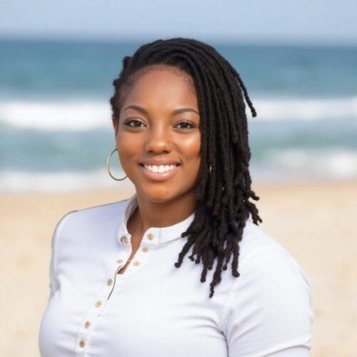 Headshot of Dr. Janaé Bonsu-Love, director of research at the Building Movement Project.